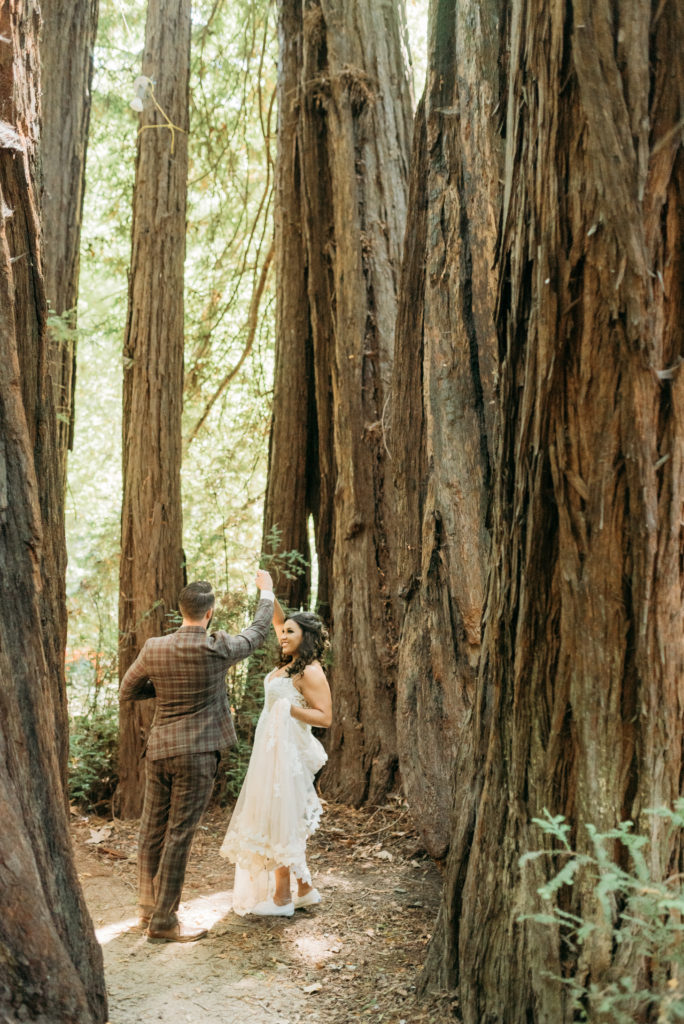 Forest dancing with the bride and groom in the forest with trees surrounding.