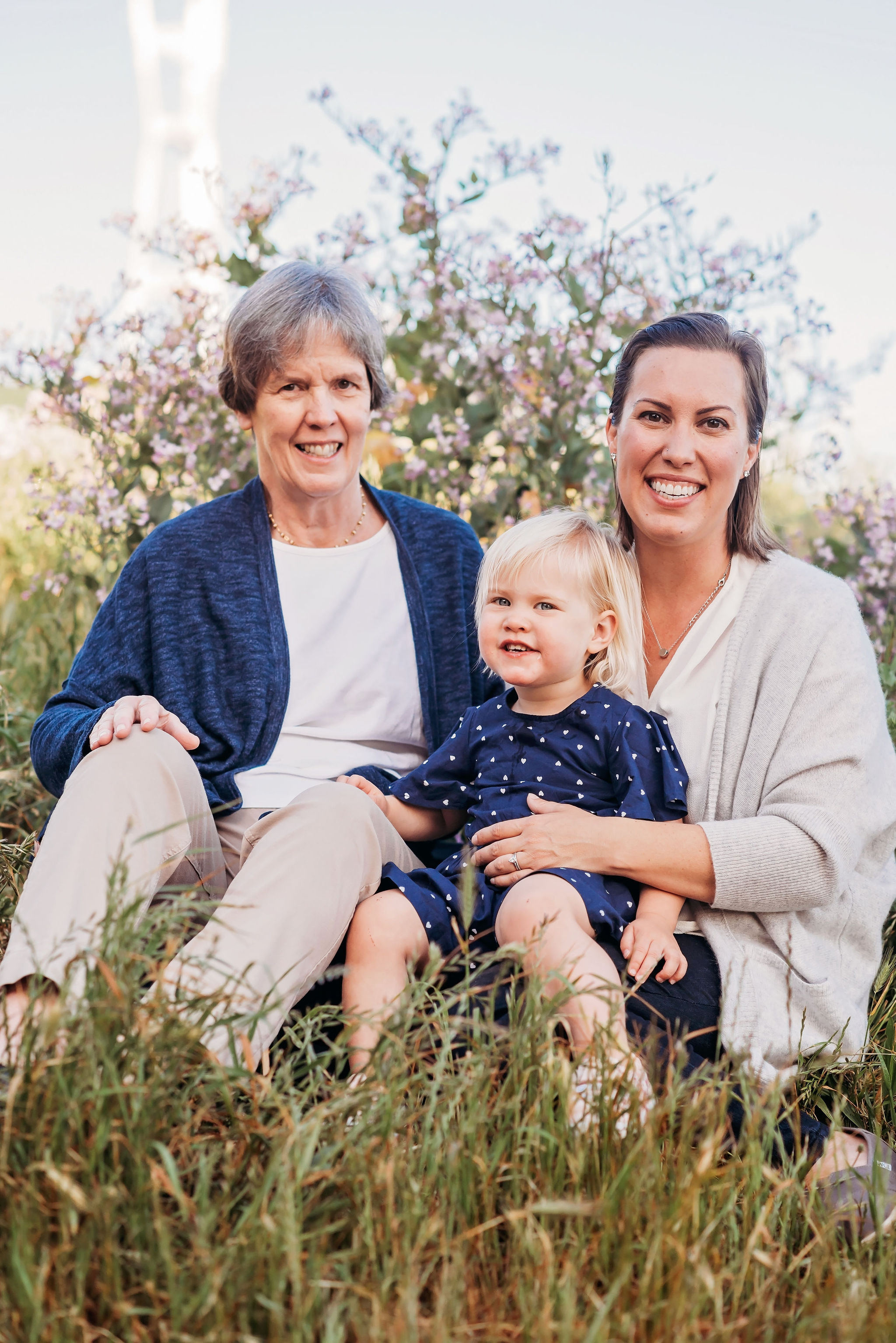  I love this three-generation photo! The two colors in their palette were navy and cream; this was balanced out by having Grandma in a navy cardigan, Mom in a cream shirt + sweater, and sweet Daughter in her navy polk-a-dots. Another example of why you only need one patterned piece in a photo! 